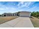 Charming single-Gathering home featuring a two-car garage and a long concrete driveway at 11 Lateen Sail Dr, Placida, FL 33946