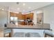Stylish kitchen with dark wood cabinets, a breakfast bar, and stainless steel appliances, perfect for cooking at 11 Lateen Sail Dr, Placida, FL 33946