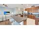 Well-designed kitchen with a breakfast bar, stainless steel appliances, and an open layout to the living space at 11 Lateen Sail Dr, Placida, FL 33946