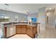 Bright kitchen with stainless steel appliances, granite countertops, and an open design overlooking the living area at 11 Lateen Sail Dr, Placida, FL 33946