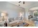 Bright living room featuring a comfortable sofa, stylish coffee table, and an open view to the dining area at 11 Lateen Sail Dr, Placida, FL 33946