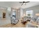 Airy living room features a ceiling fan, comfortable seating, and a view of the entryway at 11 Lateen Sail Dr, Placida, FL 33946