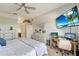 Charming bedroom with a ceiling fan, a dedicated workspace, and soothing colors, offering a tranquil retreat at 11 Lateen Sail Dr, Placida, FL 33946