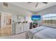 Spacious primary bedroom with a calming color palette, a dedicated workspace, and ample natural light at 11 Lateen Sail Dr, Placida, FL 33946