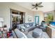 Inviting outdoor patio with comfortable seating, a ceiling fan, and scenic views, perfect for relaxation and entertainment at 11 Lateen Sail Dr, Placida, FL 33946