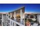 Wide condo balcony showing outdoor seating with views of the city at 111 S Pineapple Ave # 1210, Sarasota, FL 34236