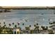 Picturesque bay with sailboats along the city coastline and palm trees at 111 S Pineapple Ave # 1210, Sarasota, FL 34236