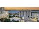 An aerial view of a cityscape showcasing buildings, palm trees, a waterway, and a vibrant city skyline at 111 S Pineapple Ave # 1210, Sarasota, FL 34236
