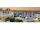 A vibrant city skyline with a view of buildings, water, palm trees, and rooftops during sunset at 111 S Pineapple Ave # 1210, Sarasota, FL 34236
