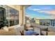 Relaxing balcony with comfortable seating and stunning views of the cityscape and water at 111 S Pineapple Ave # 1210, Sarasota, FL 34236