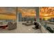 Expansive balcony offering stunning city views, complete with lounge chairs, seating, and a unique sculpture at 111 S Pineapple Ave # 1210, Sarasota, FL 34236