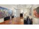 Elegant dining room featuring a large table, intricate chairs, and ample wall art at 111 S Pineapple Ave # 1210, Sarasota, FL 34236