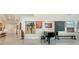 Bright hallway with a piano, art, and sleek tile flooring creates an elegant and inviting atmosphere at 111 S Pineapple Ave # 1210, Sarasota, FL 34236