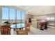 Eat-in kitchen with modern island and barstool seating offers views of the cityscape from its beautiful floor to ceiling windows at 111 S Pineapple Ave # 1210, Sarasota, FL 34236