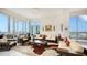 Spacious living room with floor-to-ceiling windows and a view of the skyline and balcony at 111 S Pineapple Ave # 1210, Sarasota, FL 34236