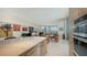 Bright and airy space with an open floor plan, showcasing the kitchen, living, and dining areas at 111 S Pineapple Ave # Ph 1210, Sarasota, FL 34236