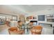 Bright and spacious open layout featuring a piano, dining space, and access to the modern kitchen at 111 S Pineapple Ave # 1210, Sarasota, FL 34236