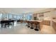 Open layout featuring a modern kitchen, living, and dining areas with floor-to-ceiling windows at 111 S Pineapple Ave # 1210, Sarasota, FL 34236