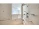 Shower featuring marble tile, shower head with a detachable showerhead, and safety grab bars at 111 S Pineapple Ave # 1210, Sarasota, FL 34236
