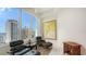 Bright room featuring large windows with city views, designer chairs, and a modern aesthetic at 111 S Pineapple Ave # 1210, Sarasota, FL 34236
