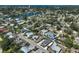 A wide aerial perspective of a residential area near waterways, showcasing multiple houses and the surrounding landscape at 1112 65Th Nw St, Bradenton, FL 34209