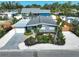 Aerial view of single Gathering home showing the front yard, driveway, landscaping, and gray roof at 1112 65Th Nw St, Bradenton, FL 34209