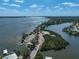 Scenic waterfront aerial showing a small marina and surrounding real estate at 1112 65Th Nw St, Bradenton, FL 34209