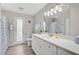 Bright bathroom features wood-look floors, and a white vanity with plenty of countertop space at 1112 65Th Nw St, Bradenton, FL 34209