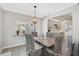 Comfortable dining area featuring neutral tones, modern lighting, and a dining table at 1112 65Th Nw St, Bradenton, FL 34209