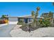 Lovely single-story home with attached garage, updated landscaping, and eye-catching palm trees at 1112 65Th Nw St, Bradenton, FL 34209