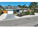 Inviting single Gathering home with vibrant landscaping, driveway, and well manicured gravel yard at 1112 65Th Nw St, Bradenton, FL 34209