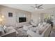 Bright living room with plush seating, modern decor, and an open layout for easy entertaining at 1112 65Th Nw St, Bradenton, FL 34209