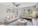 Charming living room with comfortable seating, tasteful decor, and large windows for natural light at 1112 65Th Nw St, Bradenton, FL 34209
