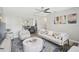Inviting living room with plush seating, modern accents, and seamless flow to the dining area at 1112 65Th Nw St, Bradenton, FL 34209