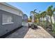Charming patio with outdoor dining area and tropical landscaping, perfect for entertaining at 1112 65Th Nw St, Bradenton, FL 34209