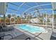 Enjoy this screened-in backyard pool featuring plenty of room for lounge chairs and greenery at 1112 65Th Nw St, Bradenton, FL 34209