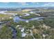 Breathtaking aerial view highlights home’s setting among lush greenery near the river at 1130 Mill Creek Rd, Bradenton, FL 34212