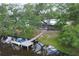 Stunning backyard view featuring a private dock, serene water, and lush green trees at 1130 Mill Creek Rd, Bradenton, FL 34212