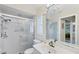 Bathroom featuring a glass-enclosed shower and large mirror at 1130 Mill Creek Rd, Bradenton, FL 34212