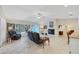 Spacious living room has tile floors, fireplace, and access to the screened lanai at 1130 Mill Creek Rd, Bradenton, FL 34212