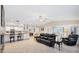 Open-concept living space with tile floors and view into the kitchen at 1130 Mill Creek Rd, Bradenton, FL 34212