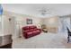 Living room features a comfortable seating area with tile floors and neutral paint colors at 1130 Mill Creek Rd, Bradenton, FL 34212