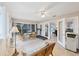 Enclosed sunroom features a seating area, a treadmill, and tiled floors at 1130 Mill Creek Rd, Bradenton, FL 34212