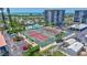 Well-maintained tennis courts and a pool area, perfect for active recreation and relaxation at 1155 Lake House Cir # C119, Sarasota, FL 34242