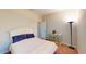 Bright bedroom featuring a queen bed, decorative dresser, and plush carpeting at 116 Navigation Cir # 106, Osprey, FL 34229