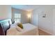 Inviting bedroom with a dark wood bed frame, a window with blinds, and closet at 116 Navigation Cir # 106, Osprey, FL 34229