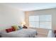 Cozy bedroom featuring neutral colors, comfortable bedding, and natural light at 116 Navigation Cir # 106, Osprey, FL 34229