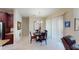 Dining room with a dark wood table and seating for four, with modern chandelier at 116 Navigation Cir # 106, Osprey, FL 34229