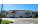 Mediterranean-style townhomes with tile roofs, garages, and well-maintained landscaping in a desirable neighborhood at 116 Navigation Cir # 106, Osprey, FL 34229