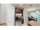 Kitchen view showcasing stainless steel refrigerator, brown cabinets, and granite counters at 116 Navigation Cir # 106, Osprey, FL 34229